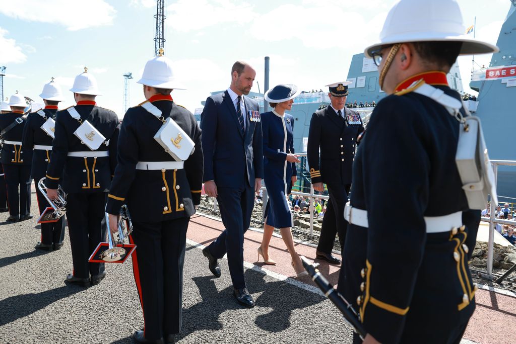 Kate Middleton wearing navy and white coat 