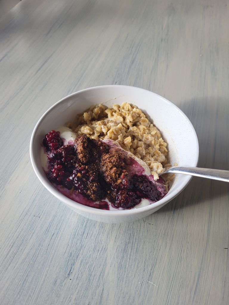 bowl of porridge with blackberries 