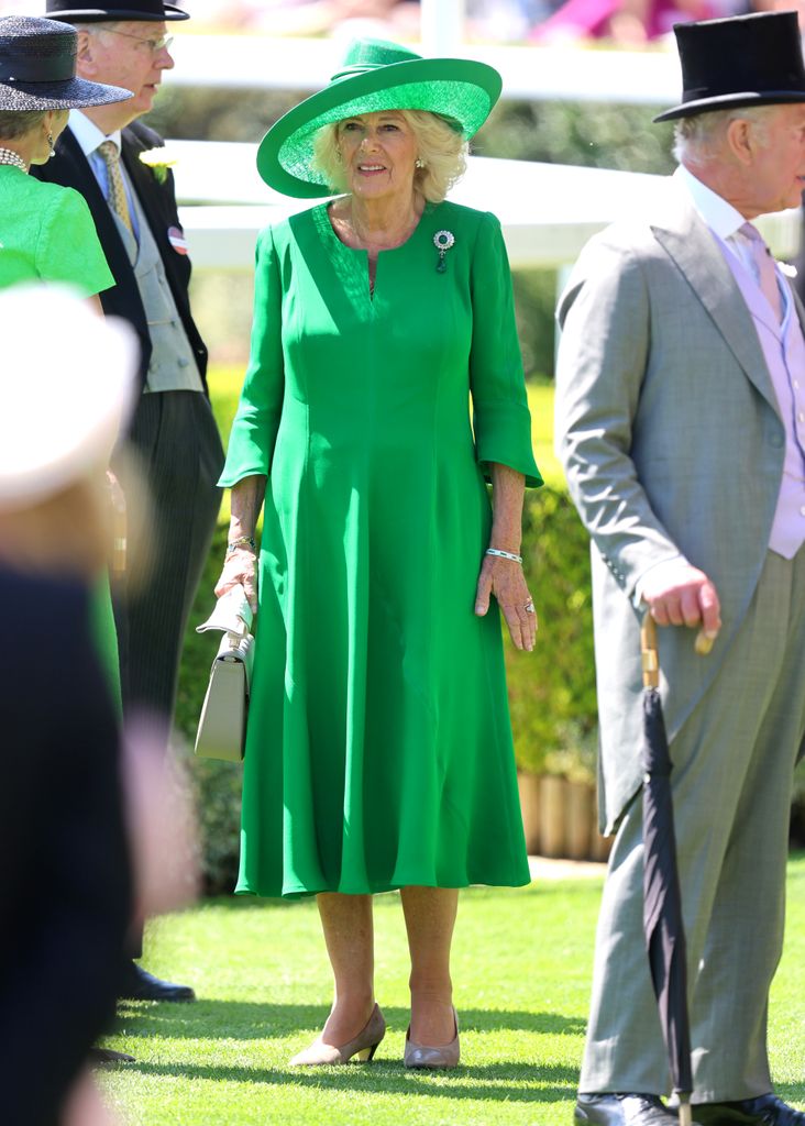 Queen Camilla in green midi dress