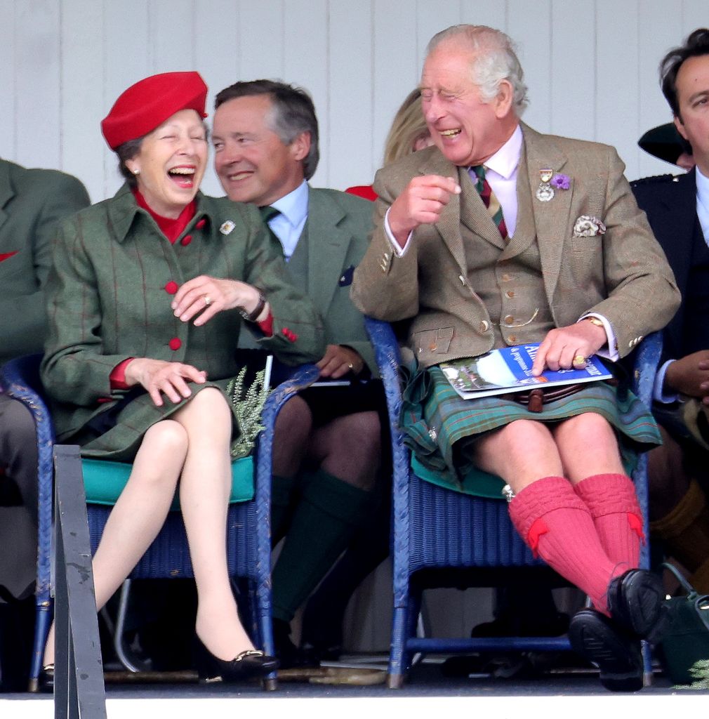 King Charles and Princess Anne laughing together