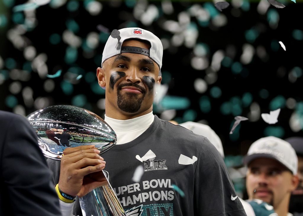 jalen hurts holding super bowl trophy