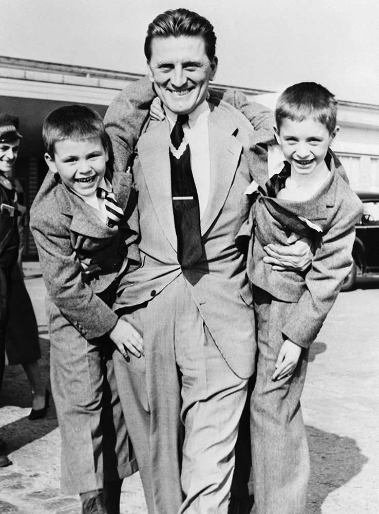 Kirk Douglas pictured with his sons Michael and Joel in March 1953