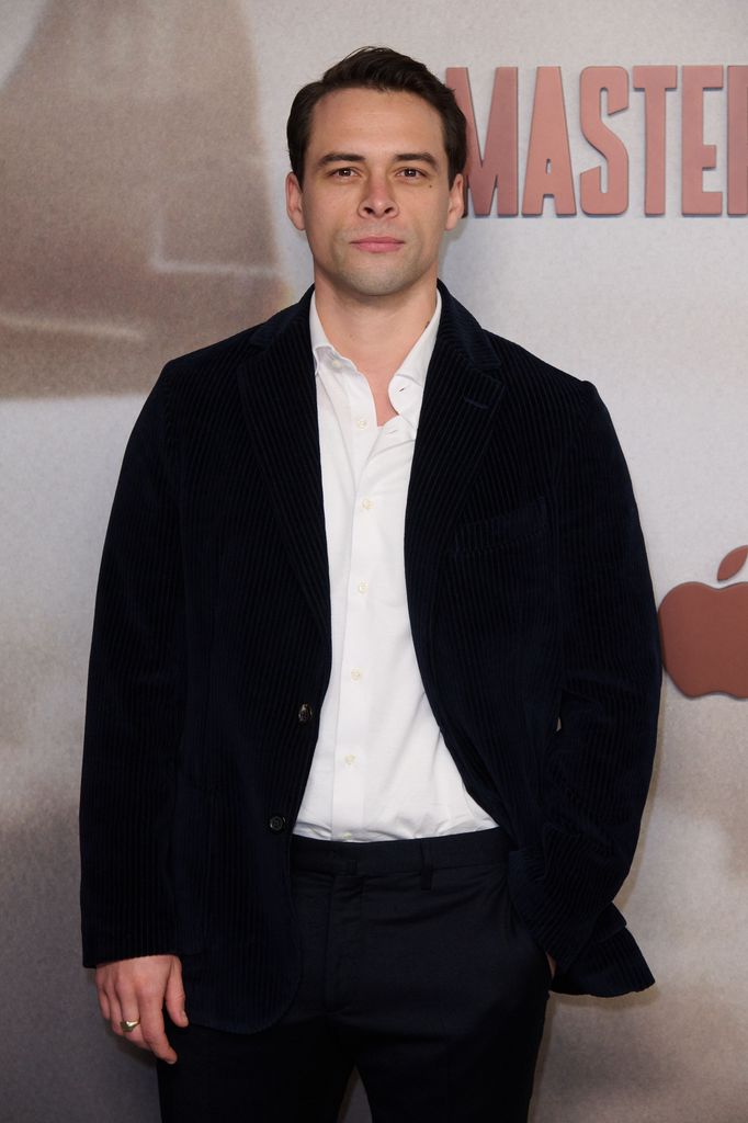actor posing for photo at TV premiere 