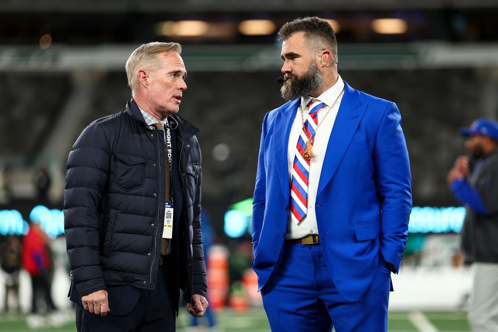 ESPN broadcasters Joe Buck and Jason Kelce talk on the field prior to an NFL game