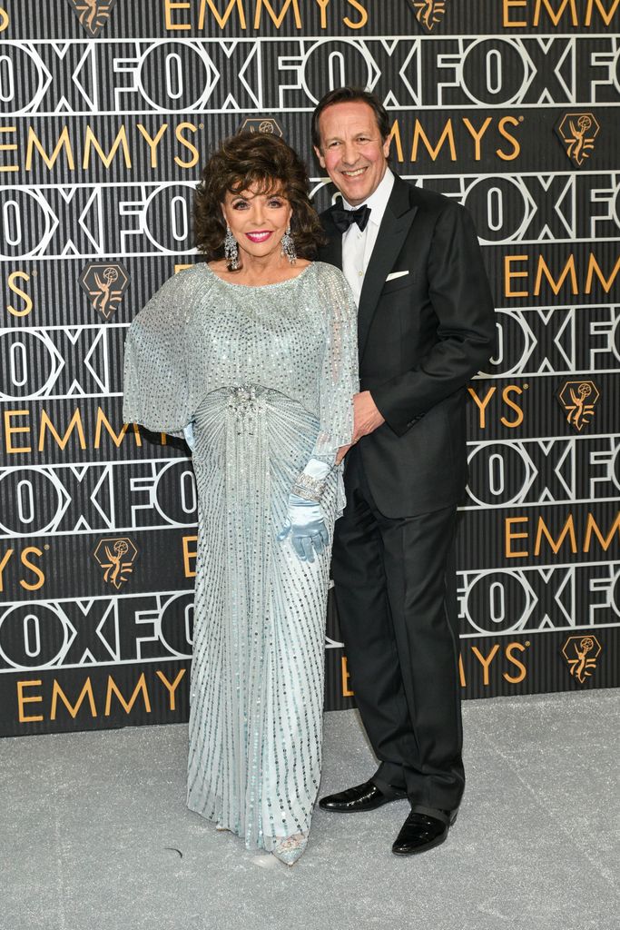 Joan Collins and Percy Gibson at the 75th Primetime Emmy Awards 