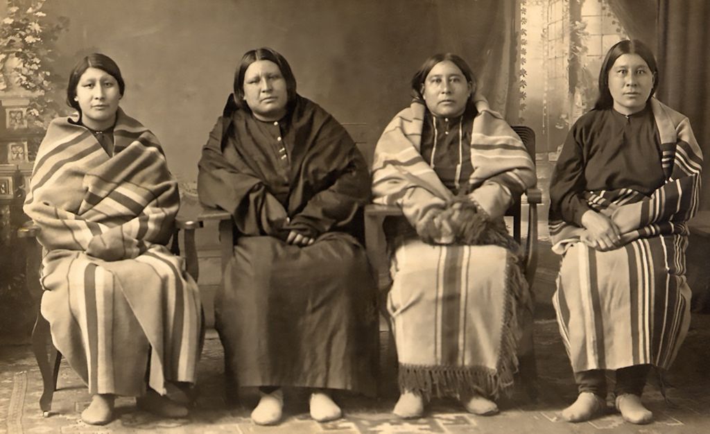 Rita Smith (left), Anna Brown (second from left), Mollie Burkhart and Minnie Smith (right) sit for a posed picture in the late 1910s