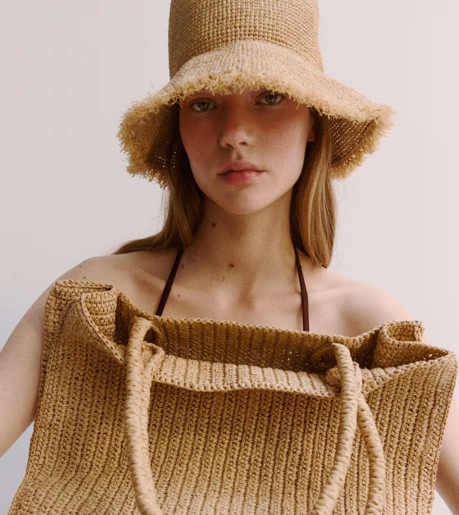 A model wears a straw bucket hat from H&M