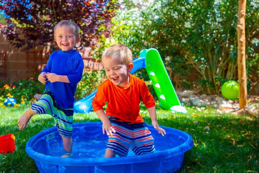 Siblings playing together in the garden