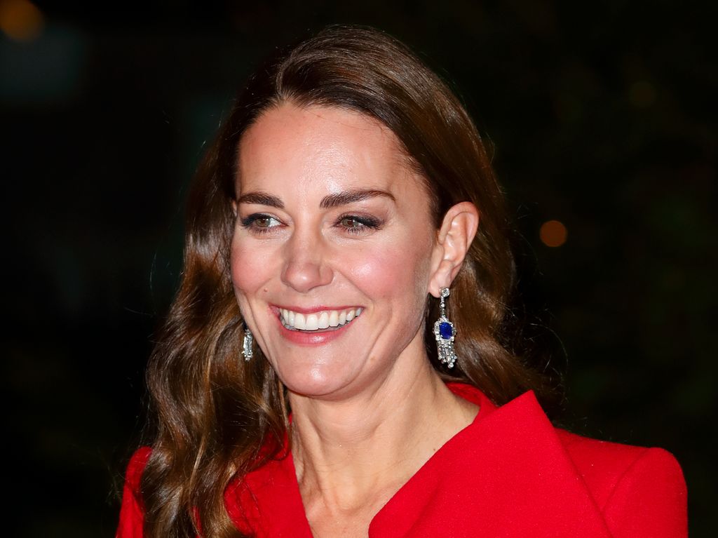 A photo of Kate Middleton wearing a red coat 