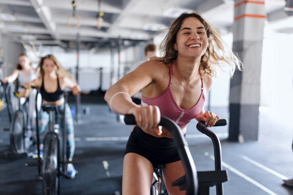 women on exercise bikes