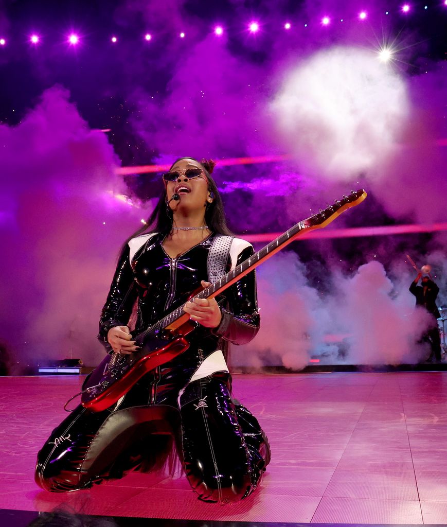 H.E.R. performs onstage during the Apple Music Super Bowl LVIII Halftime Show at Allegiant Stadium on February 11, 2024 