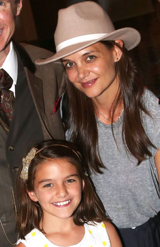 Suri Cruise and mother Katie Holmes pose backstage at the hit musical "Finding Neverland" on Broadway at The Lunt Fontanne Theatre on July 30, 2016 in New York City