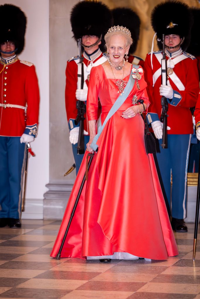 Queen Margrethe of Denmark in red dress and tiara at gala