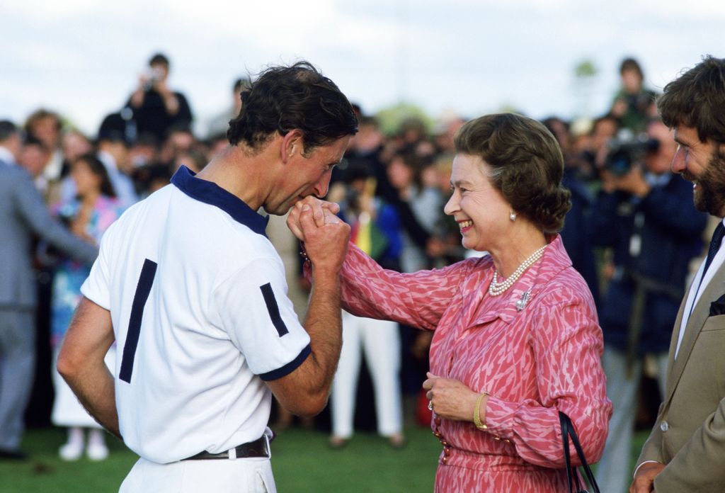 charles kissing hand of his mother at polo 