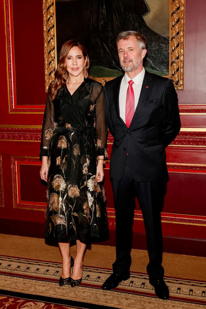 King Frederik and Queen Mary posing for a photo at Le Grand Hotel, Paris