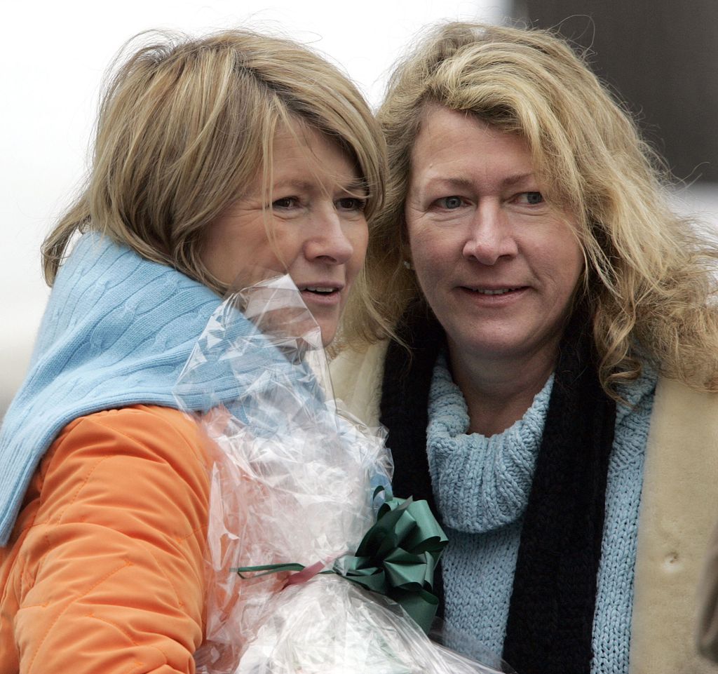 Martha Stewart (L) and her sister, Laura Plimpton, look at a visitor during a walk on Stewart's Katonah estate March 6, 2005 in Katonah, New York. Stewart was released from jail March 4 and will spend the next five months confined to her home.