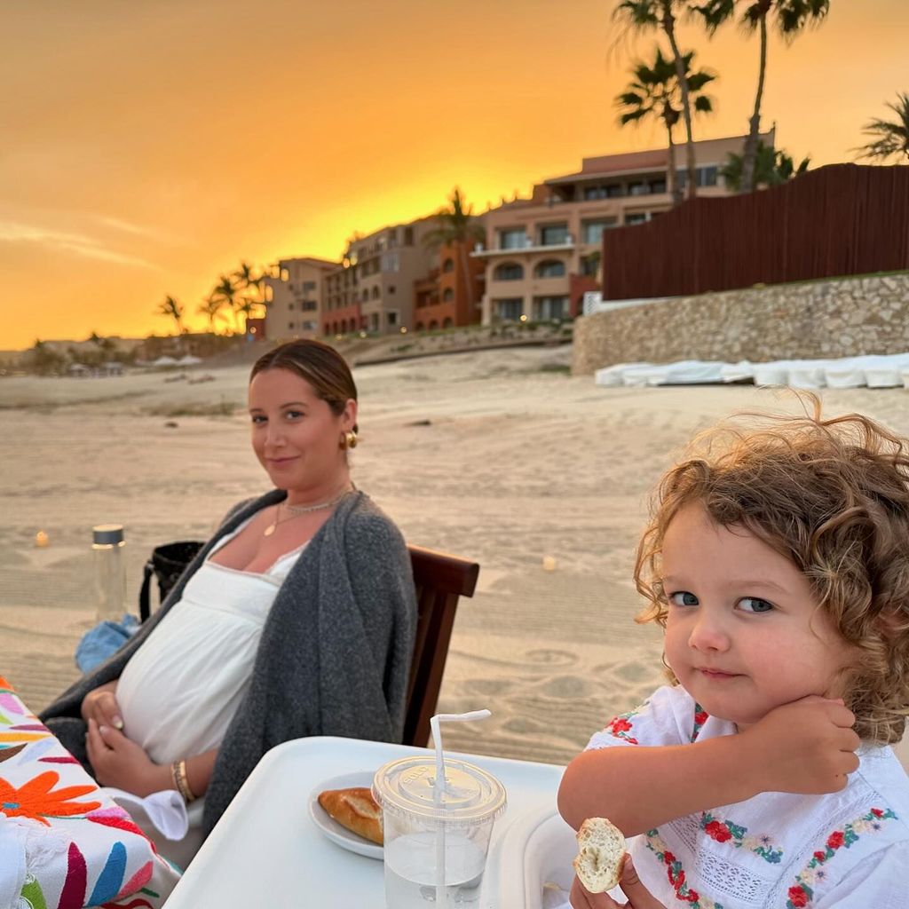 ashley tisdale with jupiter on beach