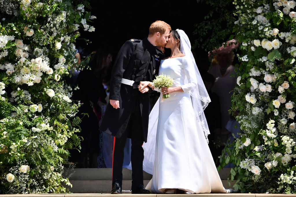 Newlyweds Prince Harry and Meghan Markle kiss following their wedding ceremony