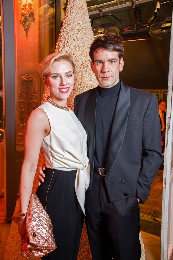 Scarlett Johansson and Romain Dauriac attend the Yummy Pop Grand Opening Party at Theatre du Gymnase on December 16, 2016 in Paris, France.
