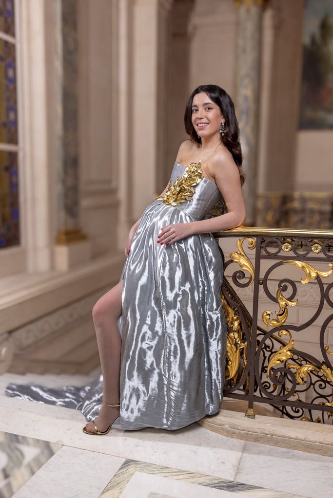 Lady wearing silver dress with gold detailing