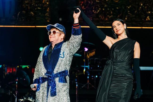 Elton John and Dua Lipa hold hands on stage at dodgers stadium show