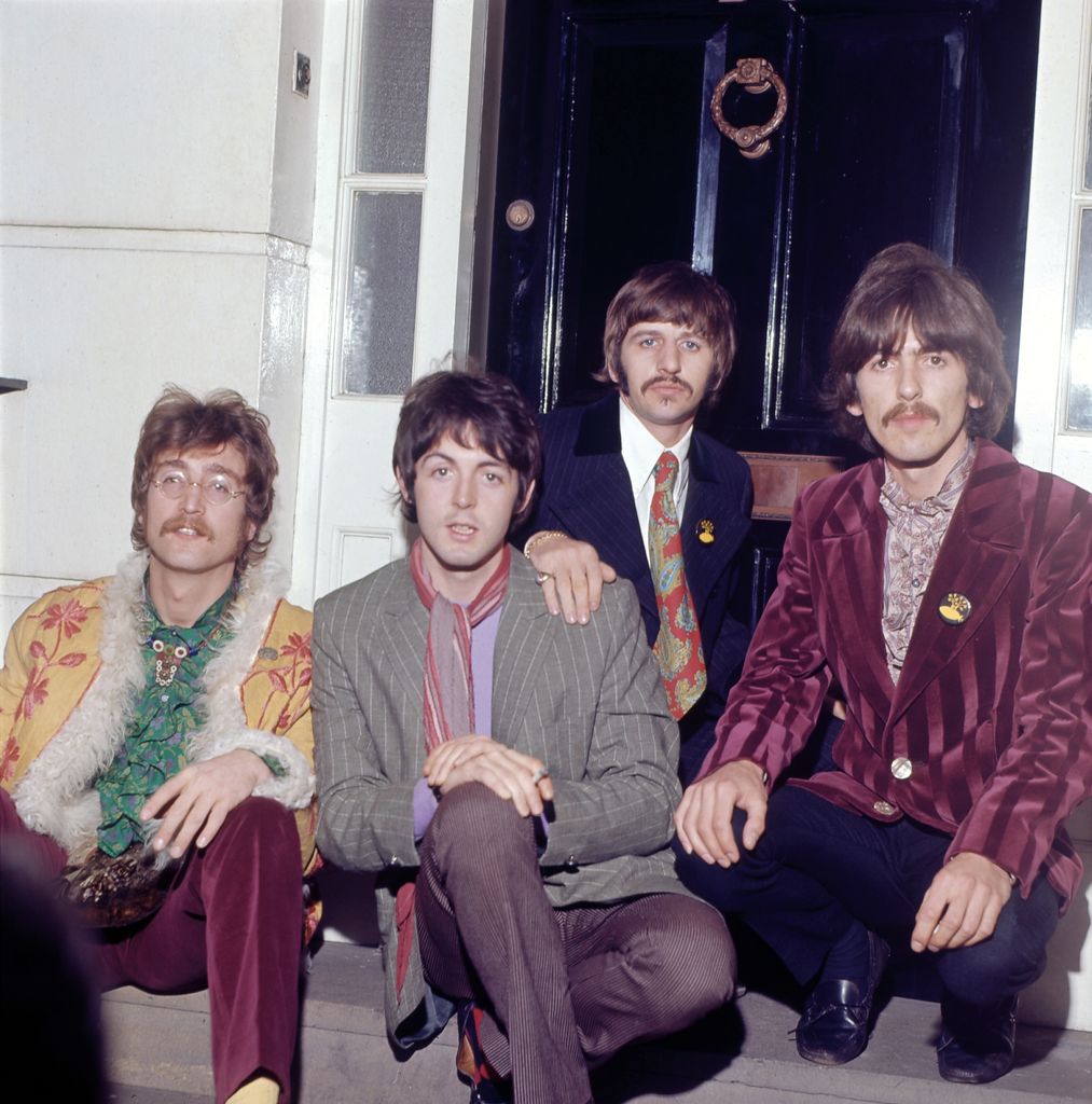 Sitting on a London stoop, the Beatles flaunt funky prints, velvet jackets, and mod neckties. Think paisley fever dream meets Carnaby Street swagger, with a dash of flower power.