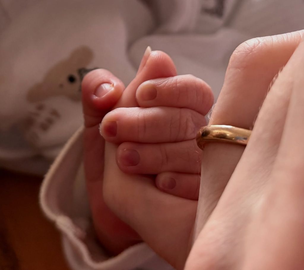 Eleanor Tomlinson shares Instagram photo of first baby's hand and husband Will Owen's wedding ring 