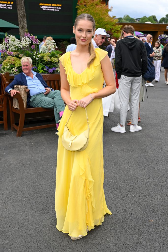 Hannah Dodd, wearing yellow Ralph Lauren dress, attends Wimbledon