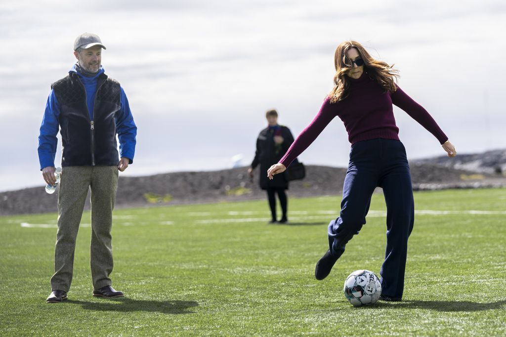 Queen Mary kicks football in Greenland