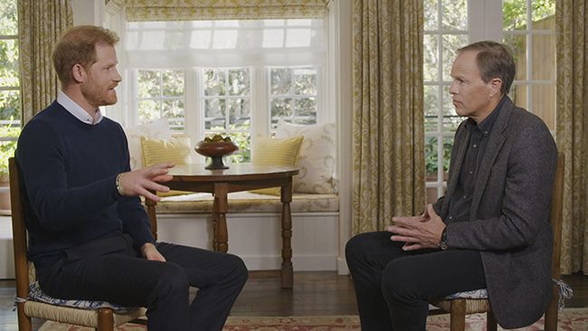 Prince Harry sits across from Tom Bradby as they chat during The Interview