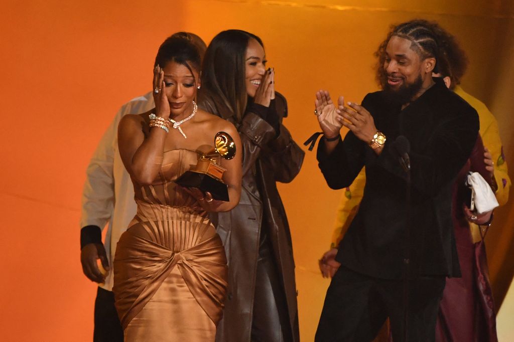 US singer-songwriter Victoria Monet (L) accepts the Best New Artist award on stage 
