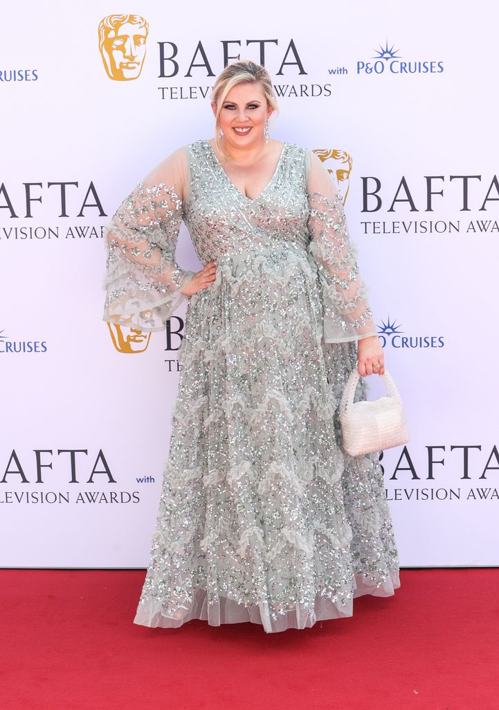 Woman in sparkling dress on the BAFTAs red carpet