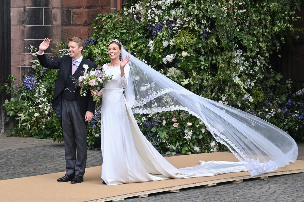 Hugh Grosvenor, Duke of Westminster, and Olivia Henson wave to crowds outside Chester Cathedral after their wedding