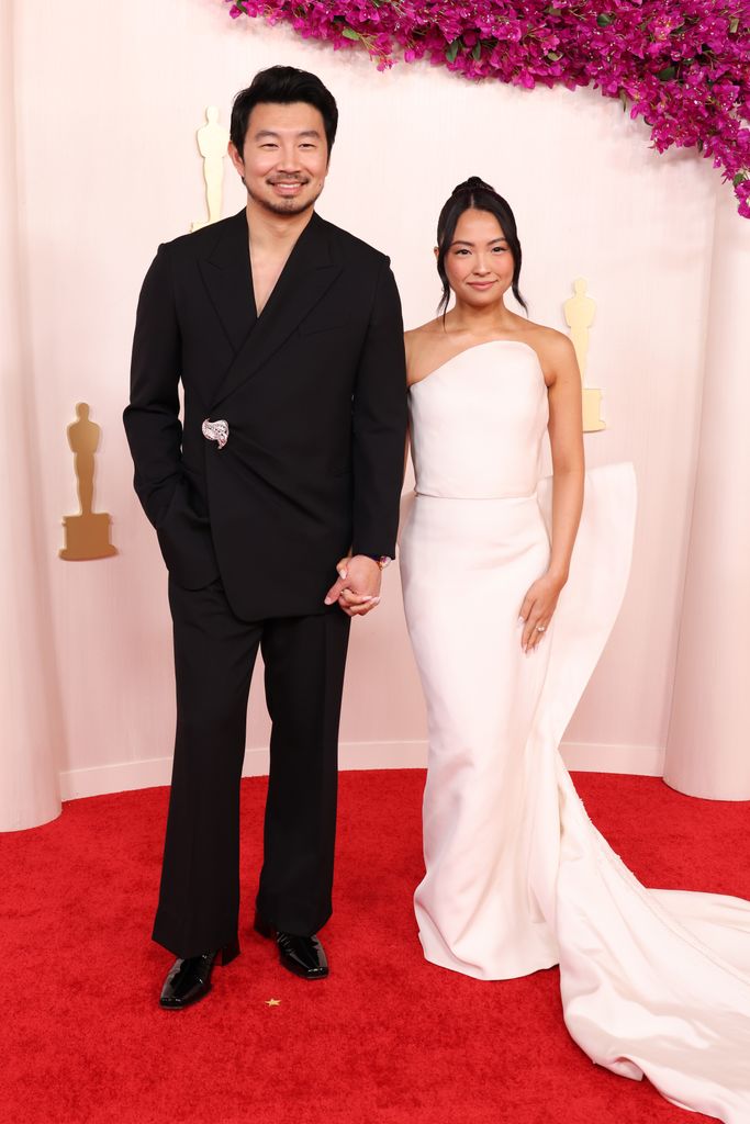 Simu Liu and Allison Hsu attend the 96th Annual Academy Awards 