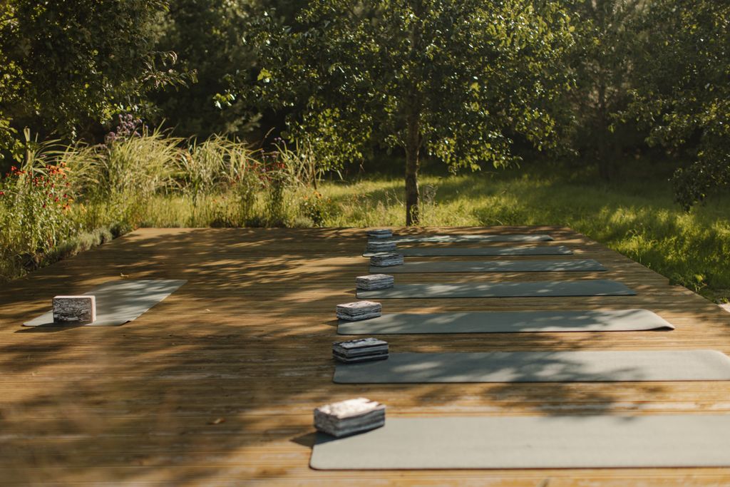 yoga mats laid out in woodland area
