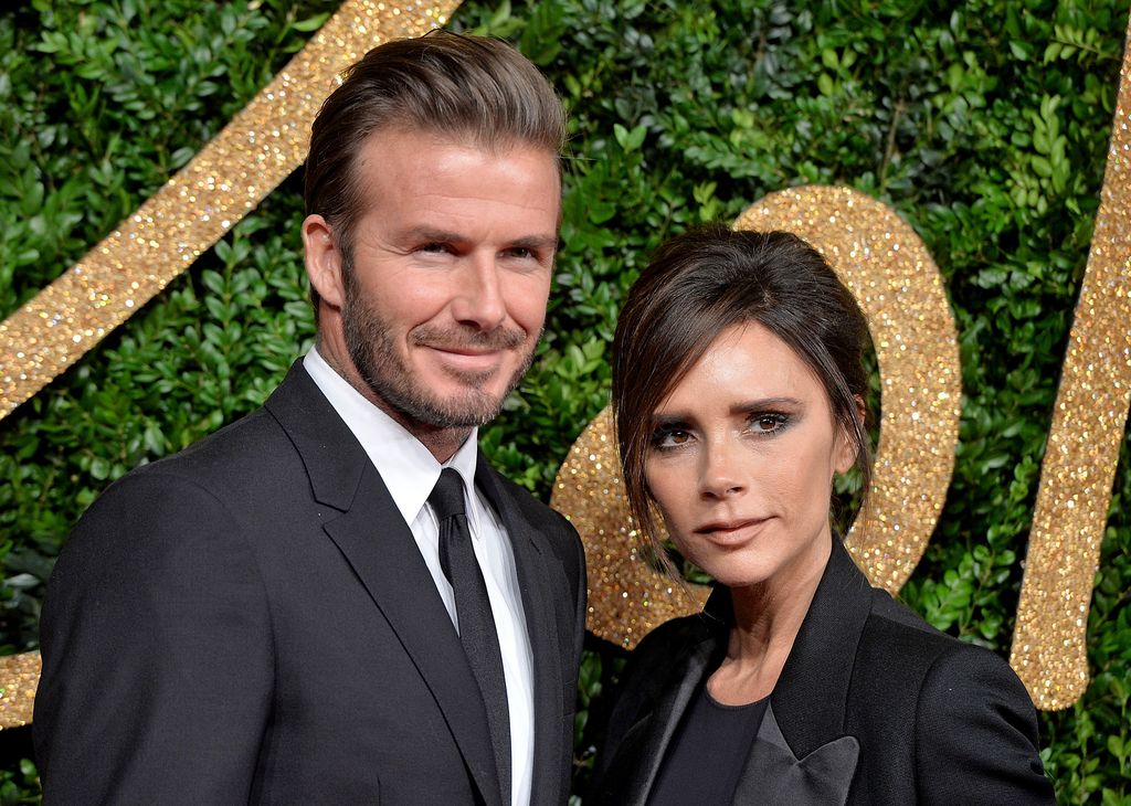 David Beckham and Victoria Beckham at an awards ceremony in all black