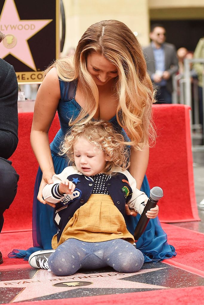 Actress Blake Lively poses for a photo with her daughter, James Reynolds during a ceremony honoring Ryan Reynolds with a star on the Hollywood Walk of Fame on December 15, 2016