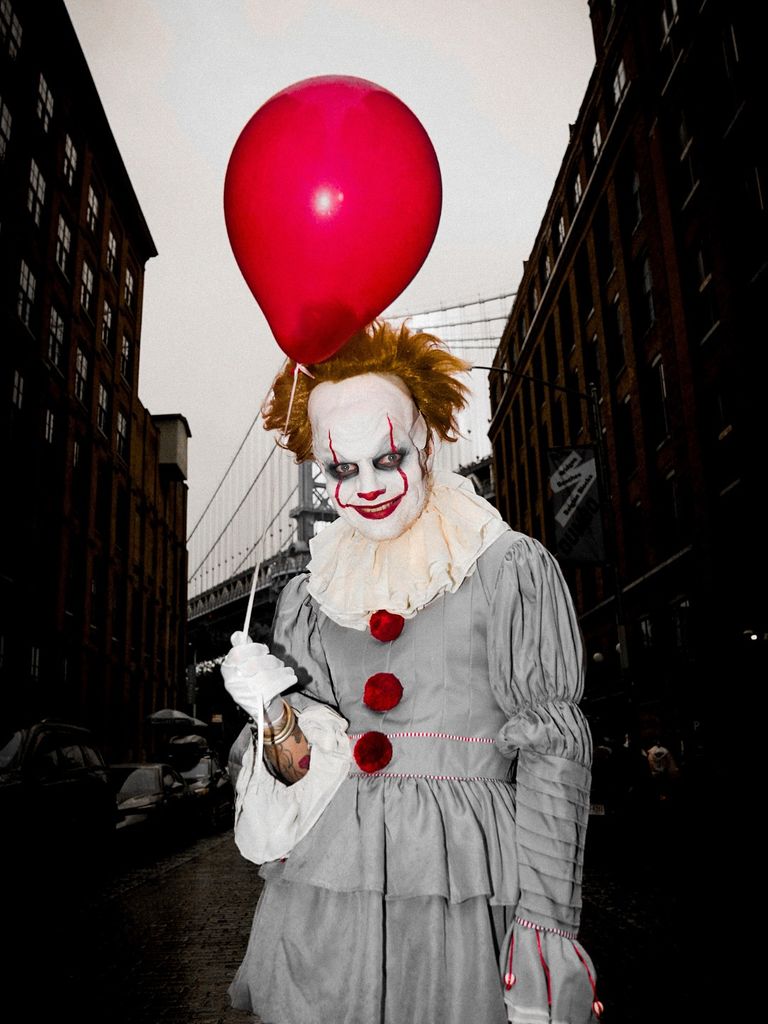 ed sheeran dressed as pennywise clown holding red balloon