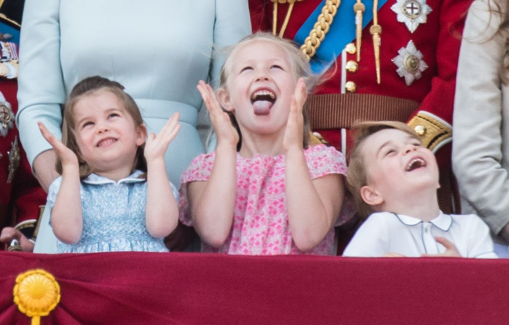 Princess Savannah Phillips looking cheery next to Princess Charlotte and Prince George