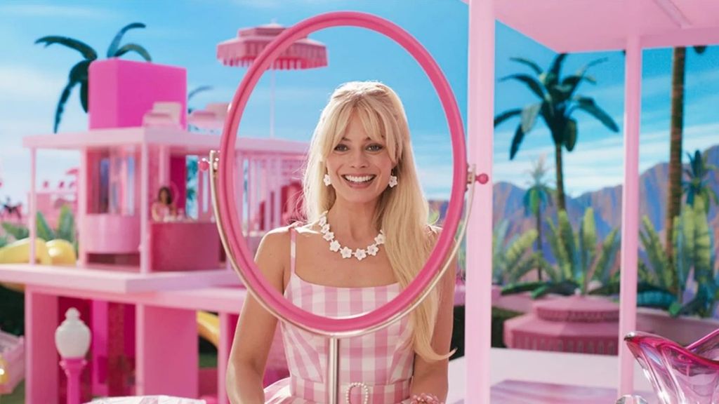 Margot Robbie plays Barbie in pink gingham dress