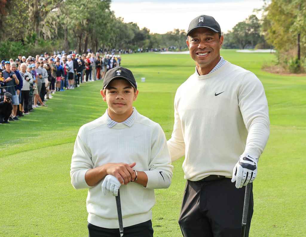 tiger woods and son charlie on golf course