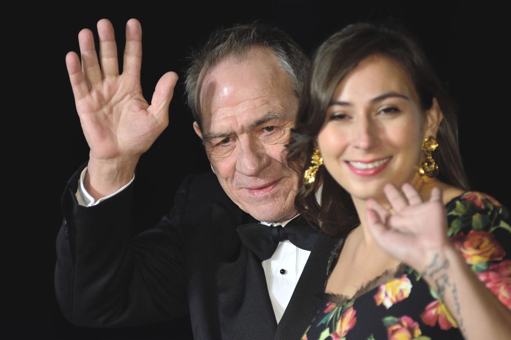 Tommy Lee Jones and his daughter Victoria Jones waving