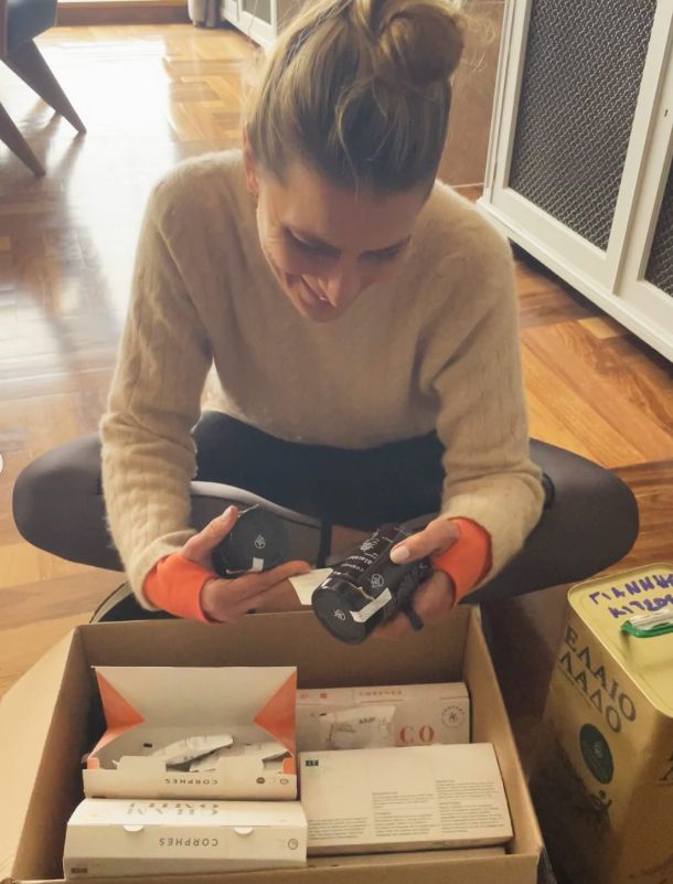 Princess Tatiana taking a black object out of a box