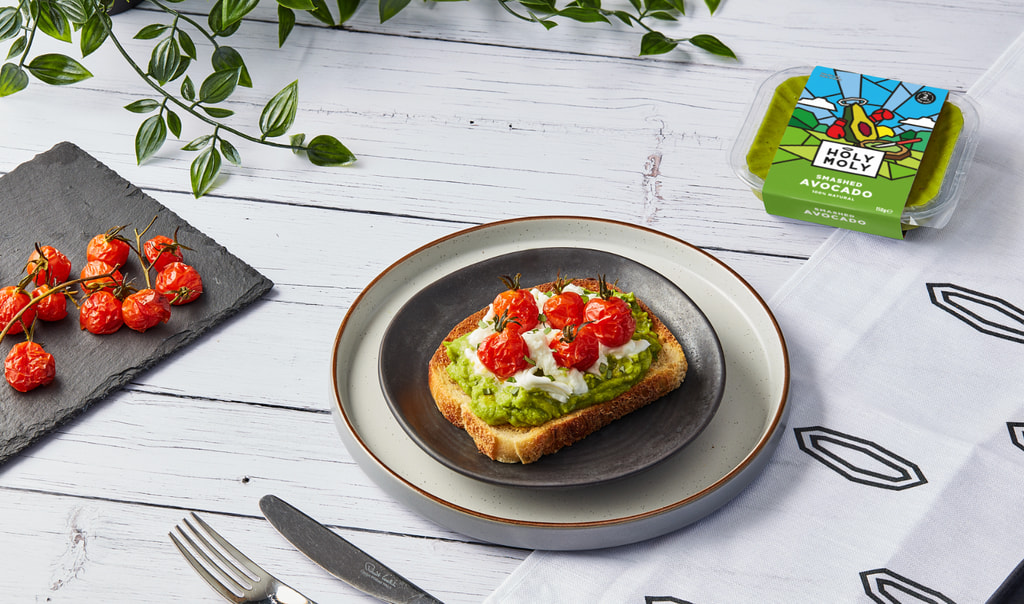 avocado toast with tomatoes on plate