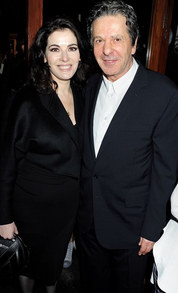 Nigella Lawson in a black dress with her ex-husband Charles Saatchi