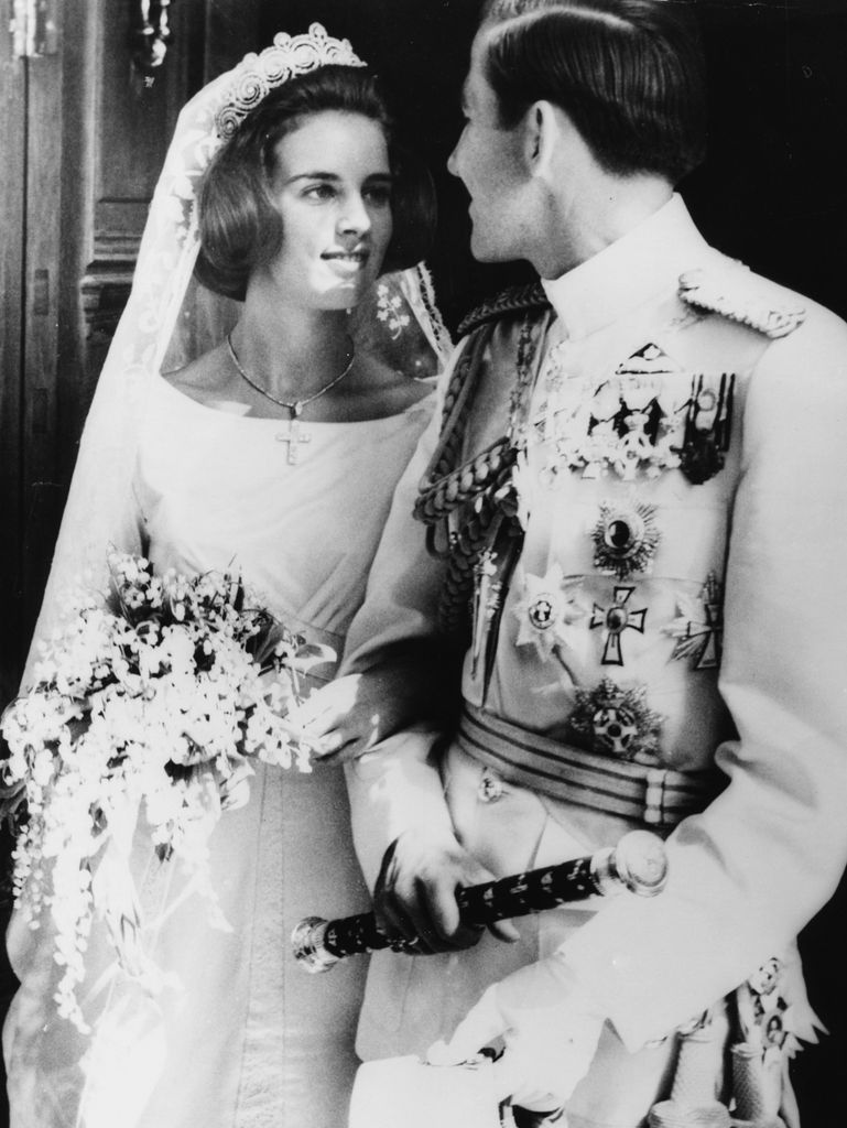 King Constantine of Greece and Princess Anne Marie gazing into each other eyes on their wedding day in 1964