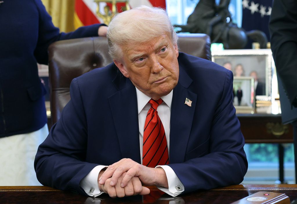 President Donald Trump speaks to reporters after signing a proclamation in the Oval Office
