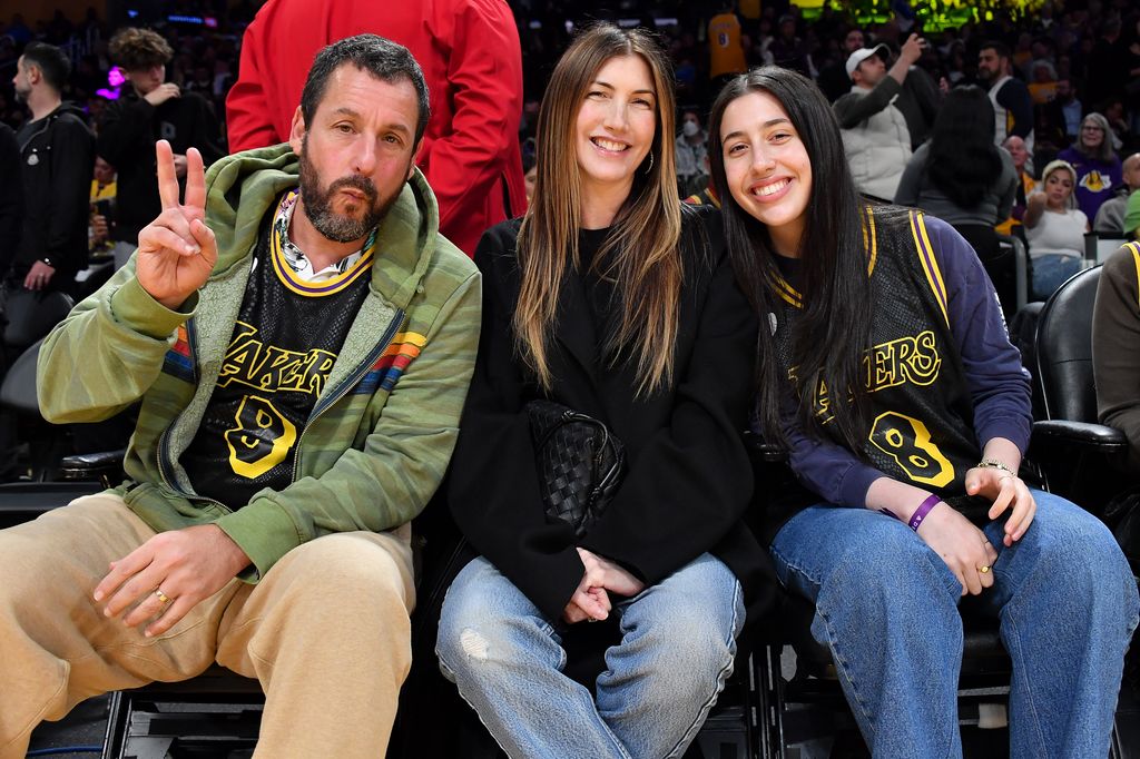 Adam Sandler, Jackie Sandler and Sadie Sandler attend a basketball game between the Los Angeles Lakers and the Denver Nuggets