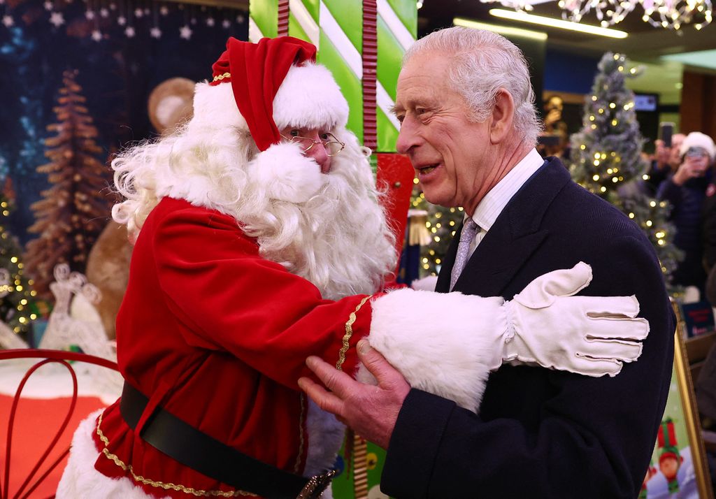 King Charles cuddling Santa