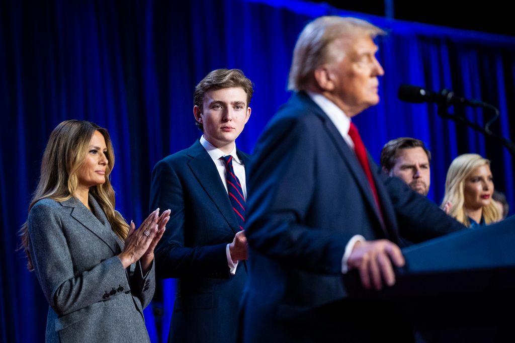 Melania Trump and son Barron Trump listen as Republican presidential nominee former President Donald Trump speaks in Flordia